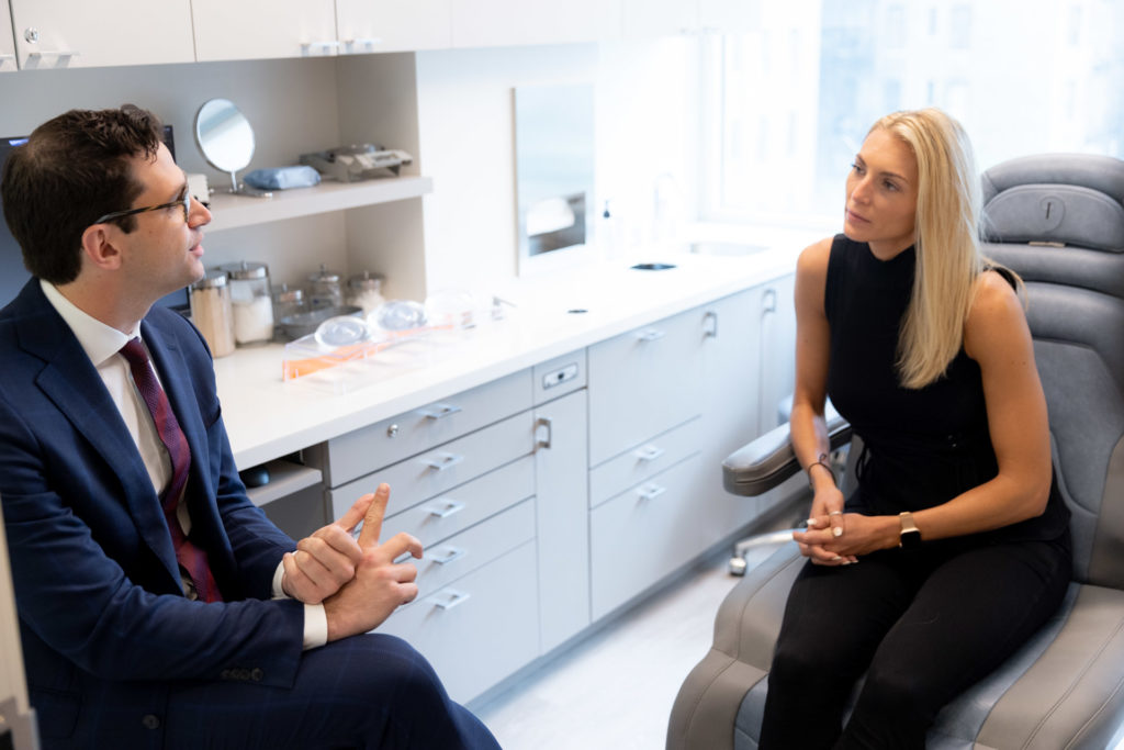 Dr. Stein at surgical consultation with young blonde woman