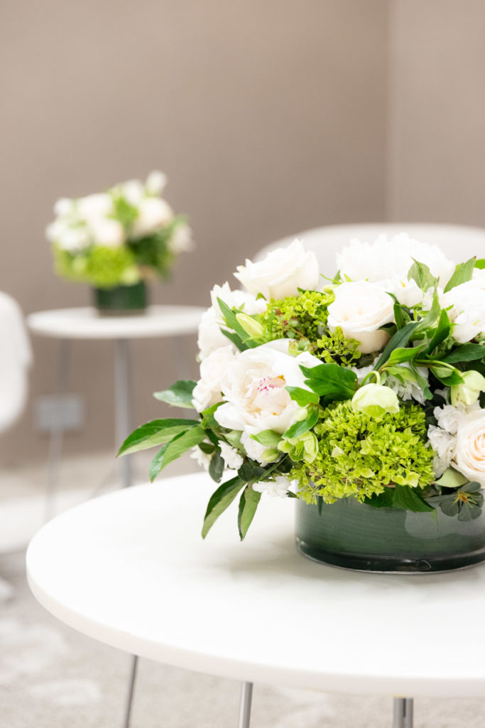 white and green flowers on a table