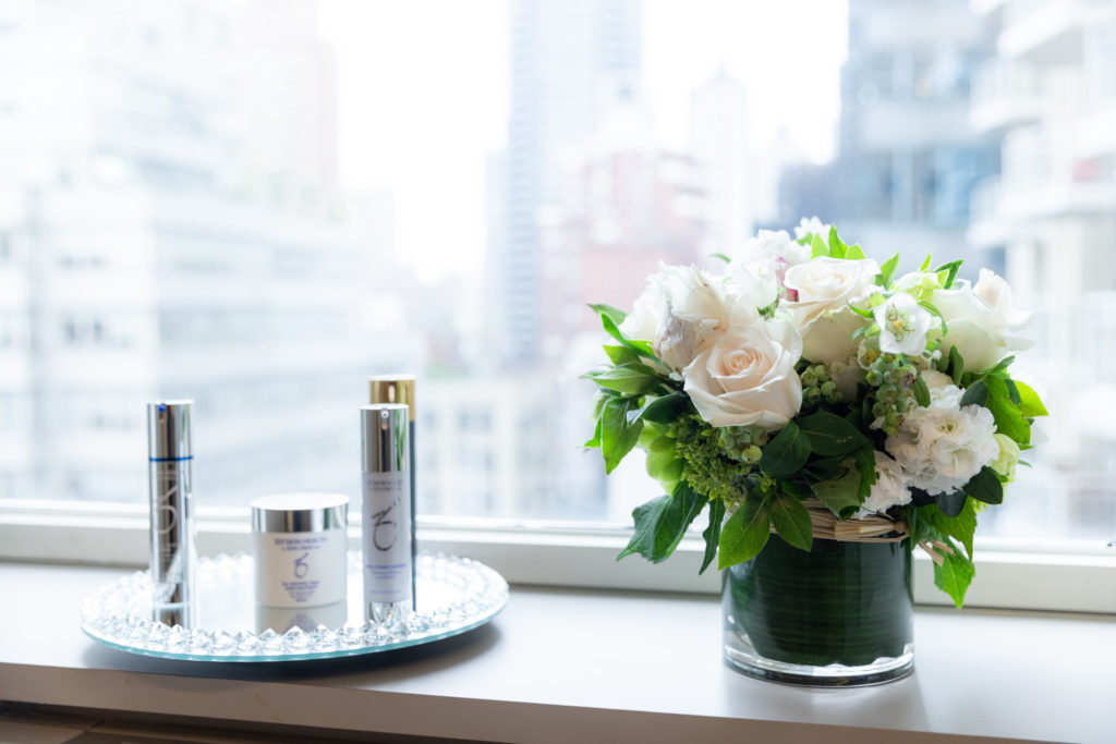 flowers and some products by a window
