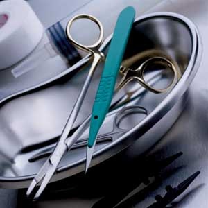 surgical tools in a metal pan