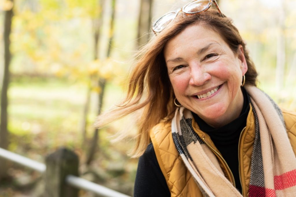 middle age woman smiling outside