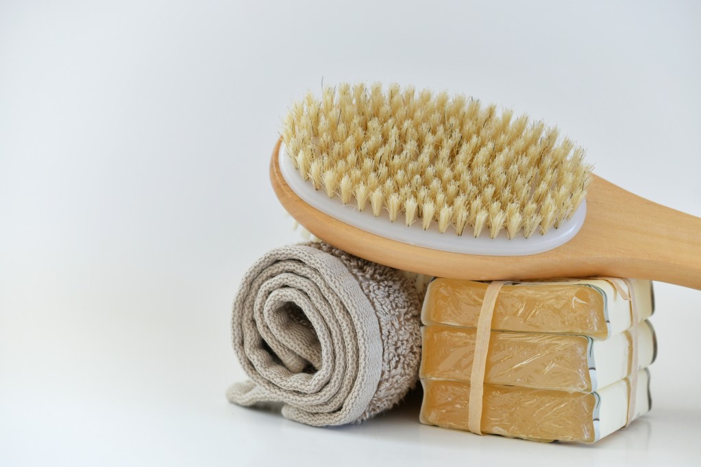 brush on top of washcloth and soaps