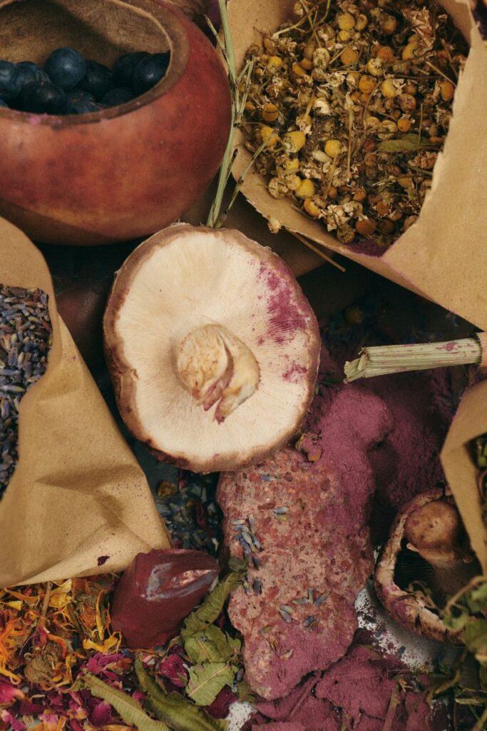 Overhead view of rustic whole-grain foods and fresh fruits arranged with a warm fall color palette